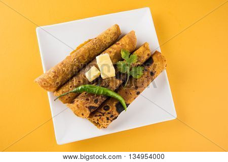Hot delicious paratha with ghee, green chilly, coriander and tomato sauce. Paratha Rolls. Chapati made using indian spices. Kolkata rolls