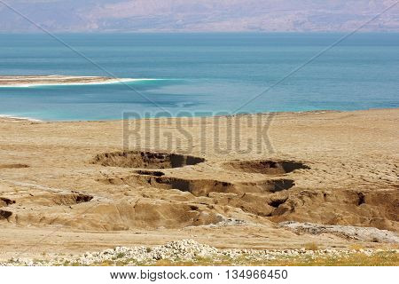 landscape of the Dead Sea, failures of the soil, illustrating an environmental catastrophe on the Dead Sea, Israel