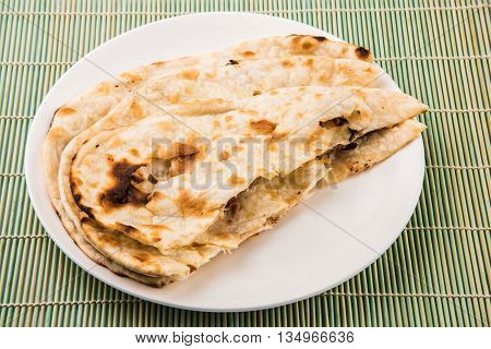 Homemade Indian Naan Flatbread made with Whole Wheat, plain indian roti, plain tandoori roti