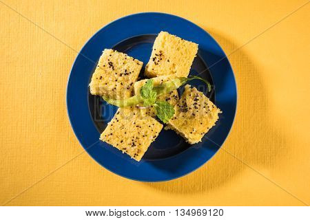 Gujrati famous snack made up of gram flour, semolina called khaman Dhokla
