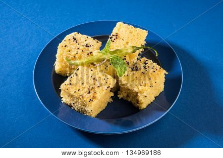 Gujrati famous snack made up of gram flour, semolina called khaman Dhokla