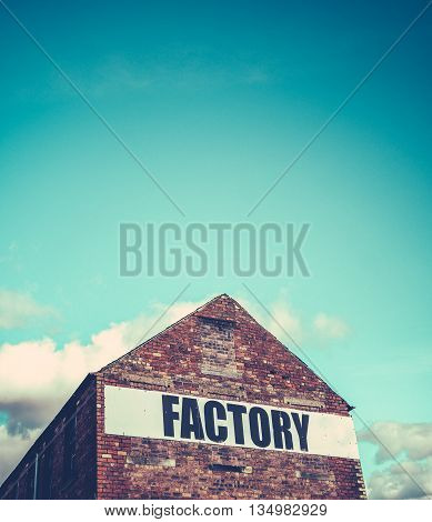 Urban Industrial Red Brick Factory Building With Blue Sky And Copy Space