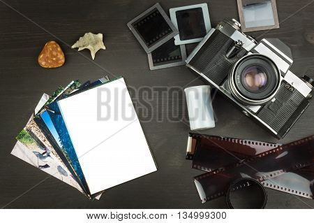 Old photos of the seaside holiday. The old camera. Memories of the sea. Family album photos. Memories of youth. Greetings from the seaside holiday. Equipment artistic photographer.