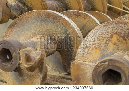 Detail Shot Of Some Dirty Old Auger Drills