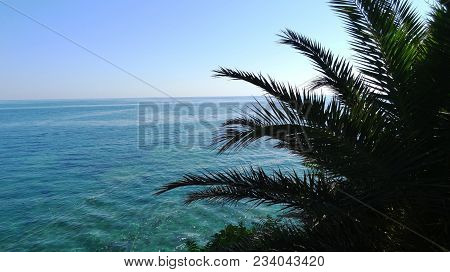 Wide Water Above The Water Of The Mediterranean Sea, Crossing The Scene At Sunset With Warm Soft Lig