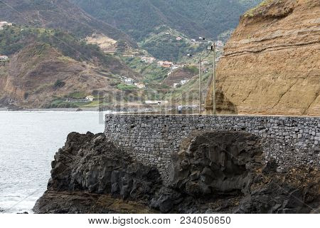 Cliff Along The Promenade In Porto Da Cruz On Madeira. Portugal
