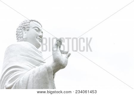 Statue Of Buddha Standing Hand Raised In Gesture Of Vitarka Mudra