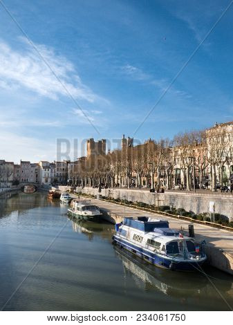Boats On The Robine Canal In The Center Of Narbonne On A Sunny Winter Day