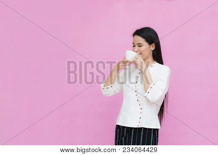Portrait Beautiful Asian Girl In Traditional Thai Dress And Holding Coffee Cup Isolated On Pink Back