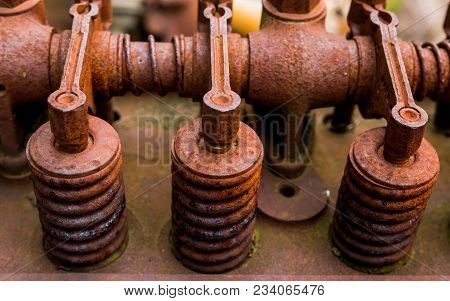 Vintage Antique Automotive Cylinder Head Rocker Shaft, Arms, And Springs Covered In Orange Rust And 
