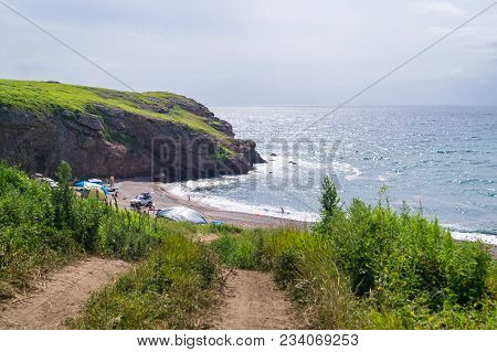 The Far Eastern Landscape Of One Of The Picturesque Bays Of The Peninsula Of Krabbe. People Bathe In