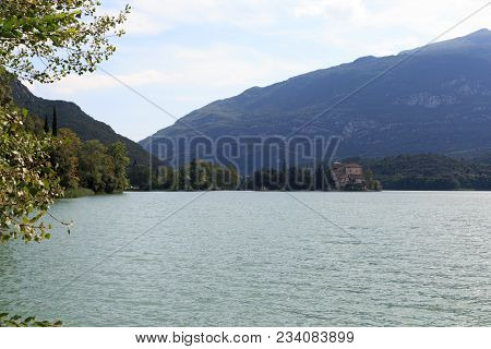 Castle Castel Toblino At Lake Lago Di Toblino And Mountain Panorama In Italy
