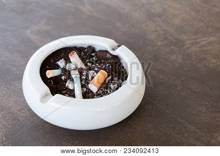 Burnt Cigarette Butts And Ashes.