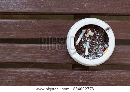 Burnt Cigarette Butts And Ashes.