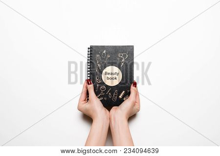 Manicure For The Client. Close-up Of The Hands Of A Manicurist And Client On A White Background
