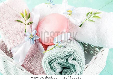 Spa Relax And Bath Concept, Sea Salt, Soap, With Cosmetics And Towels On Light Blue Conrete Backgrou