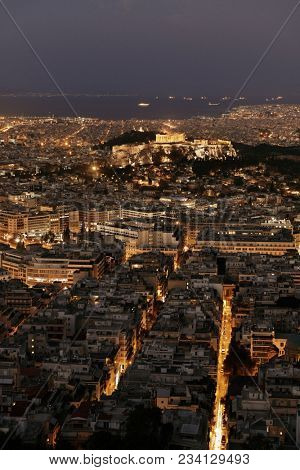 Athens skyline at night viewed from Mt Lykavitos with Acropolis, Greece.