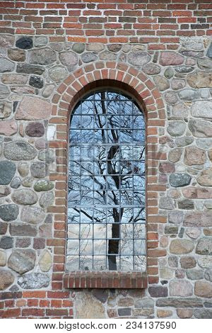 Tree Reflection In A Window. Uggeløse Church In 2017