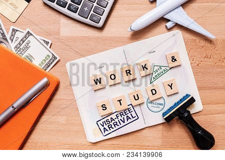Words Work And Study And Visa Free Arrival Stamp On Foreign Passport With Airplane Model. Oversea Tr