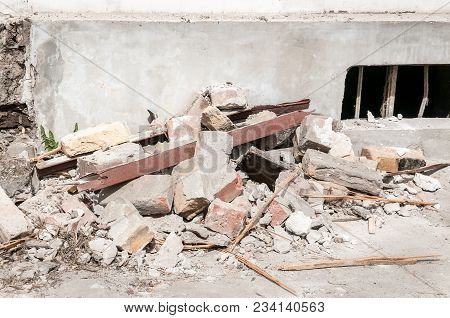 Destruction. Demolition And Destruction Site Bricks Remains Of Building Material On The Ground By Th