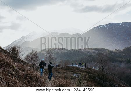 Glenfinnan, Scotland - March 17, 2018: People On A Viewing Platform Near Glenfinnan Viaduct, Scotlan