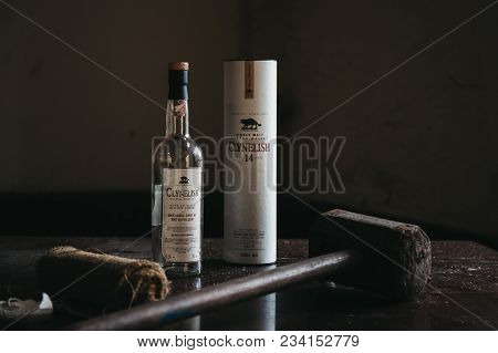 Brora, Scotland - March 22 2018:  Clynelish Whisky Bottle, Wooden Hammer And Cloth Set On A Table In