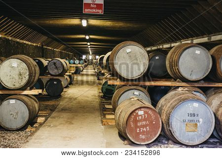 Brora, Scotland - March 22, 2018: Barrels Of Whisky Inside Brora Distillery Warehouse In Scotland, R