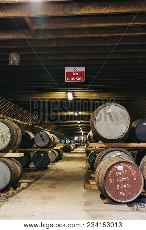 Brora, Scotland - March 22, 2018: Barrels Of Whisky Inside Brora Distillery Warehouse In Scotland, R