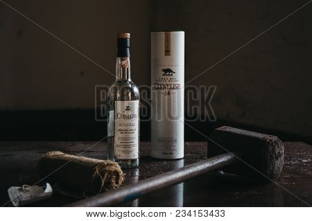 Brora, Scotland - March 22 2018:  Clynelish Whisky Bottle, Wooden Hammer And Cloth Set On A Table In