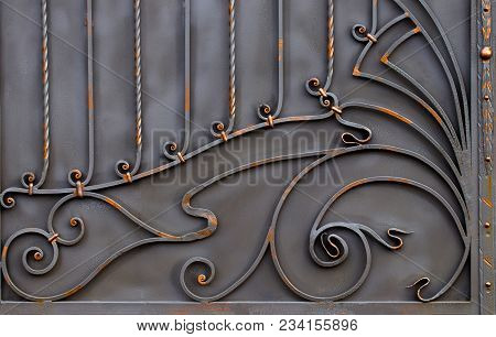 Details, And Ornaments Of Wrought Iron Fence With Gate.