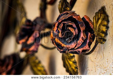 Details, Structure And Ornaments Of Forged Iron Gate. Decorative Ornamen With Roses, Made From Metal
