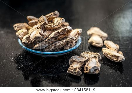 Close Up Of Ayurvedic Herb Or Folk Medicine Dried Ginger Or Zingiber Officinale In A Glass Plate On