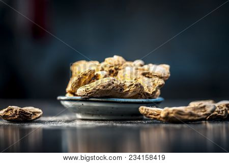 Close Up Of Ayurvedic Herb Or Folk Medicine Dried Ginger Or Zingiber Officinale In A Glass Plate On 