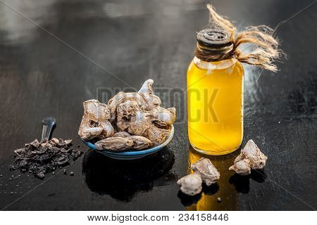 Close Up Of Ayurvedic Herb Or Folk Medicine Dried Ginger Or Zingiber Officinale With Common Cooking