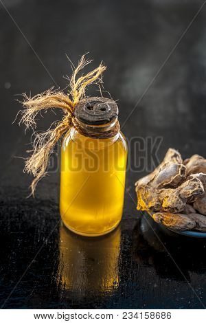 Close Up Of Ayurvedic Herb Or Folk Medicine Dried Ginger Or Zingiber Officinale With Common Cooking