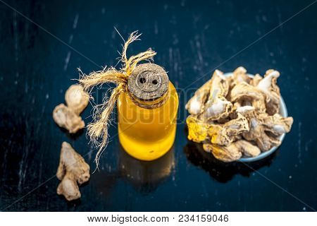 Close Up Of Ayurvedic Herb Or Folk Medicine Dried Ginger Or Zingiber Officinale With Common Cooking