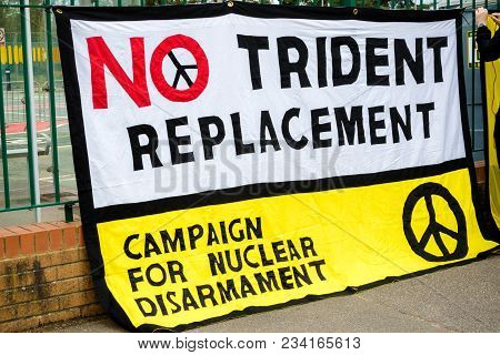 Aldermaston, United Kingdom, 1st April 2018:- Cnd Peace Banners By The Main Gate To The Awe Where Br