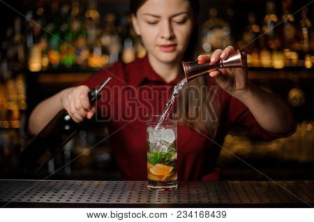 Barmaid Completes The Preparation Of The Mojito In A Crystal Glass, Adding A White Rum, Against The 