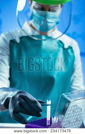 Biobanking. Technician Preparing Biological Sample For Deep Freezing