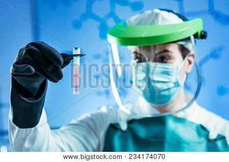 Cryopreservation. Biobanking Technician In Protective Gear Working With Biological Samples
