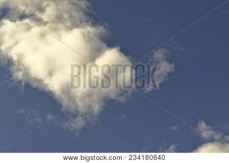 Blue April Sky With Light White Clouds Natural Background