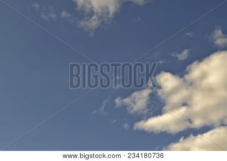 Blue April Sky With Light White Clouds Natural Background