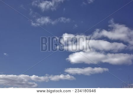 Blue April Sky With Light White Clouds Natural Background