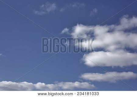 Blue April Sky With Light White Clouds Natural Background