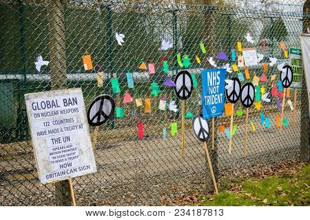 Aldermaston, United Kingdom, 1st April 2018:- Cnd Peace Banners By The Main Gate To The Awe Where Br