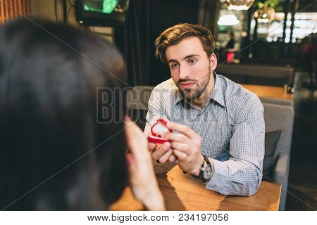 A Picture From Another Angle Where Attractive Man Is Making A Propose To His Girlfriend. He Is Nervo