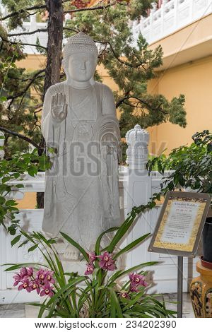 Hacienda Heights, Ca, Usa - March 23, 2018:  White Statue Of Amitabha Buddha On Side Of Garden With 