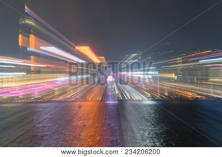 Hong Kong's Victoria Harbor And Commericial Island Illuminated In And Abstract Urban Image Of City N