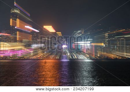 Hong Kong's Victoria Harbor And Commericial Island Illuminated In And Abstract Urban Image Of City N