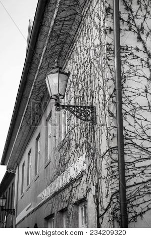 Street Lantern On House Corner With Plasterd Walls Outdoors On Yellow Background. Light, Lighting, I